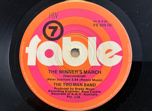 The Two-Man Band - Up There Cazaly (Seven's Footy Theme) (7", 45 RPM, Single) (Very Good (VG))