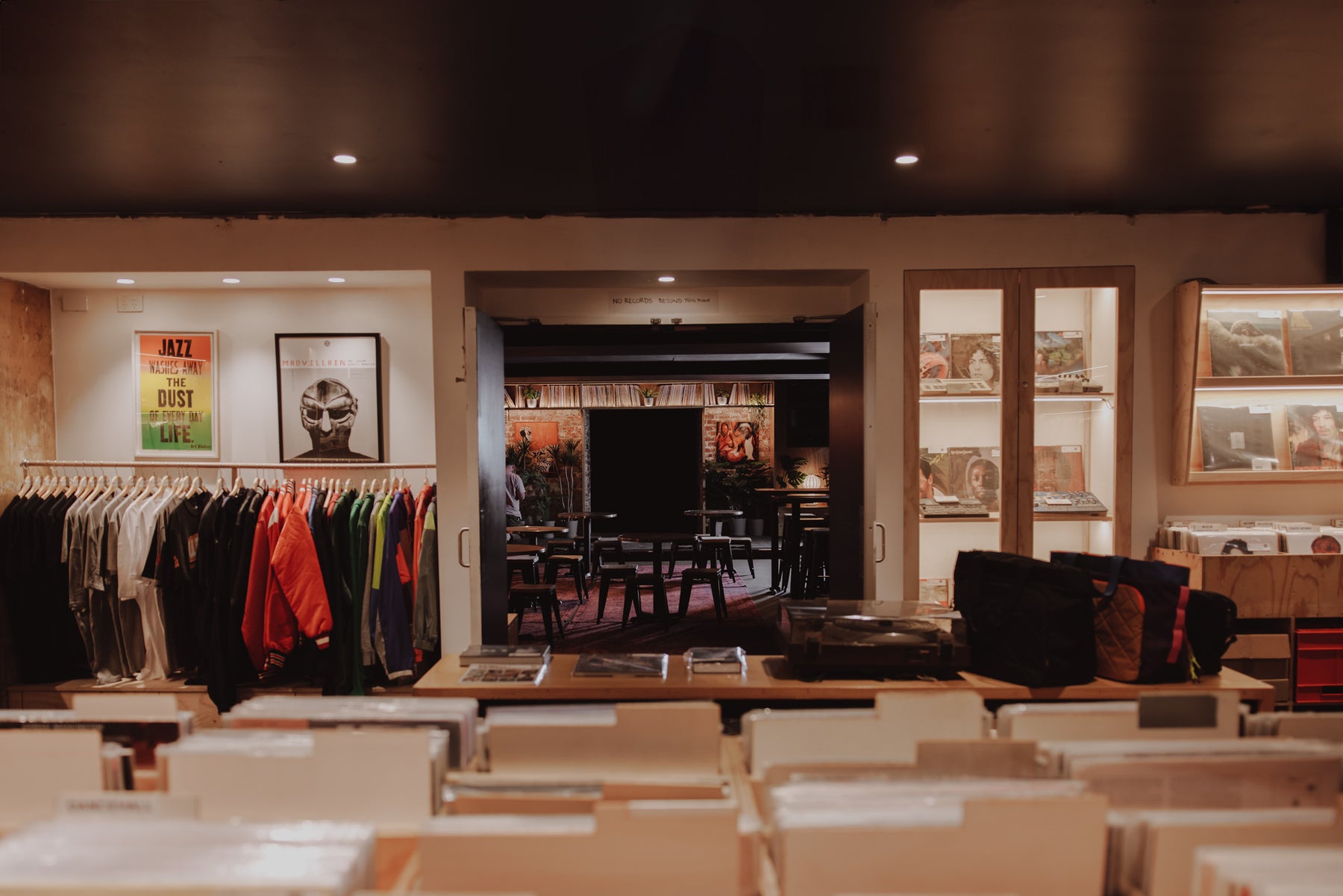 People listening to music in a record store lounge